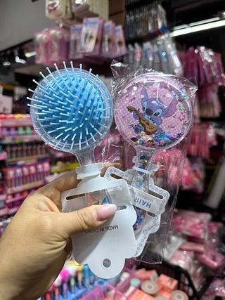 Escova de cabelo stitch