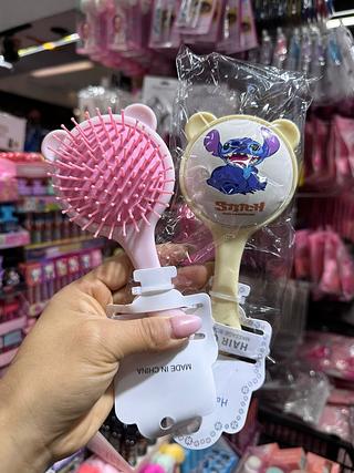 Escova de cabelo stitch