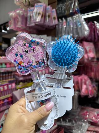 Escova de cabelo stitch